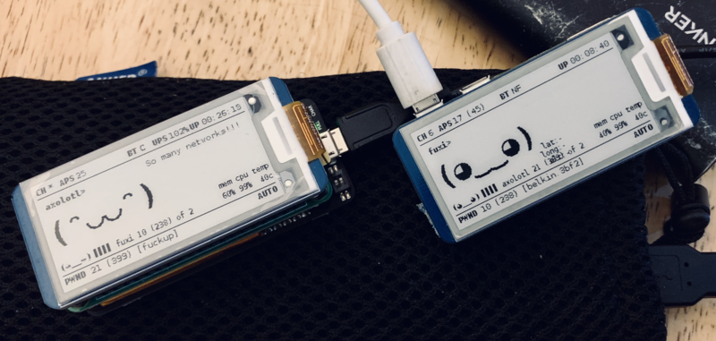 Picture of two pwnagotchis next to each other, showing the presence of fuxi and axolotl on their e-ink screen. Axolotls message reads: So many networks.